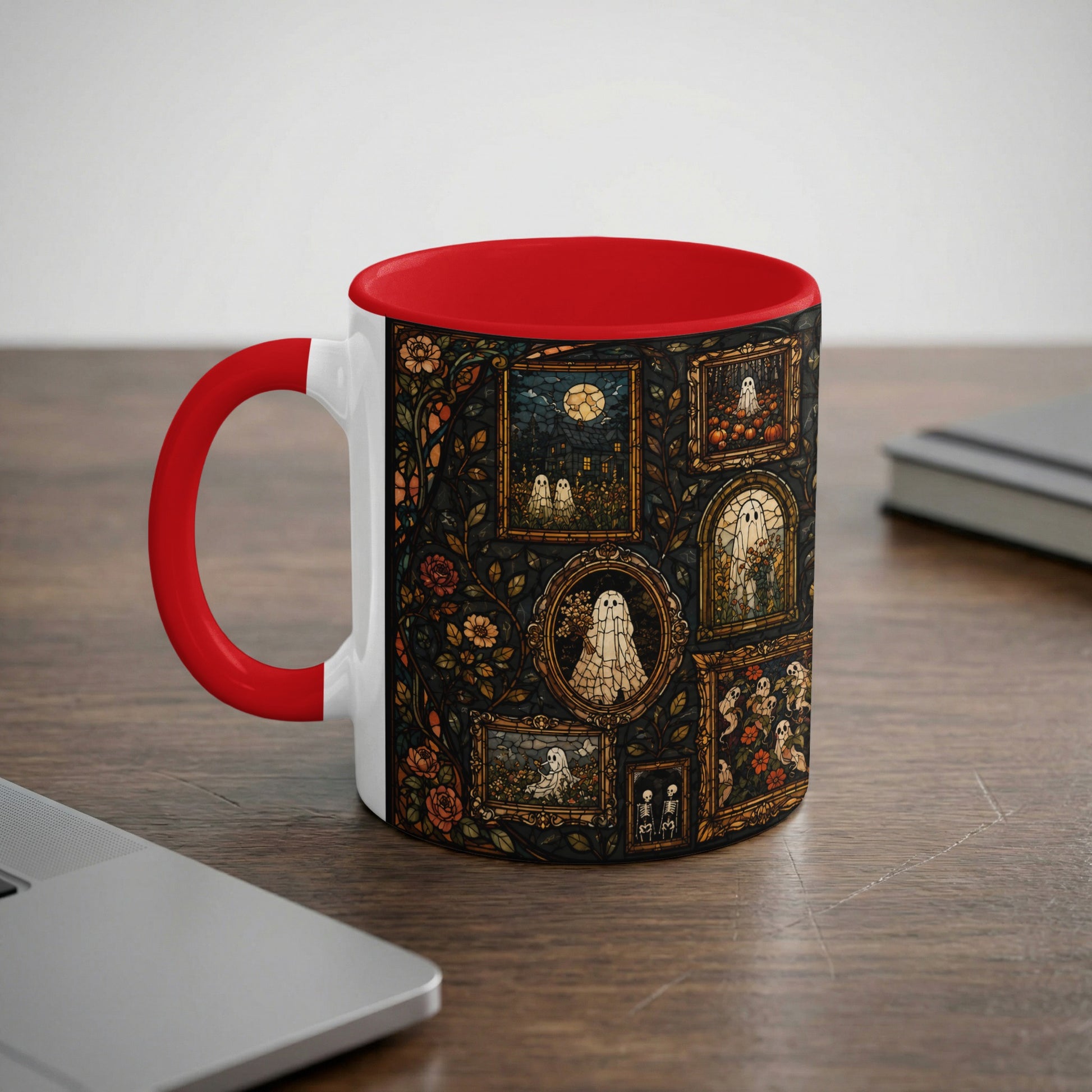 White mug with red handle, featuring a stained-glass pattern of ghosts, pumpkins, and flowers.