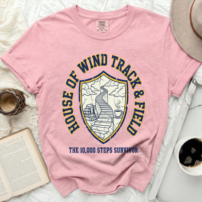 Pink t-shirt with "House of Wind Track & Field" and "The 10,000 Steps Survivor" text.