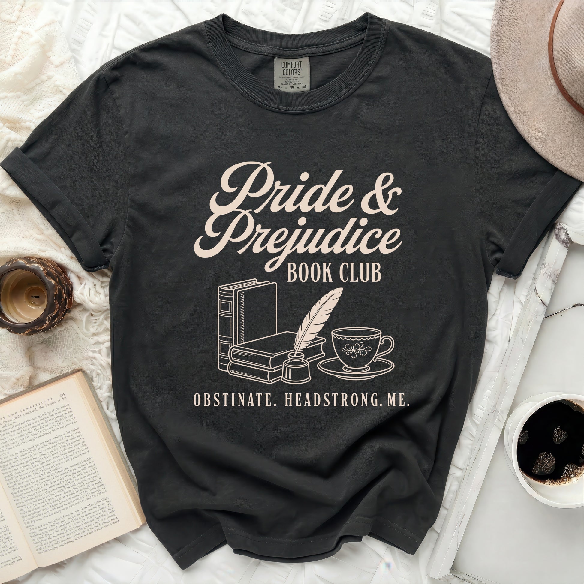 Pride & Prejudice Book Club graphic tee with books, feather, and teacup.