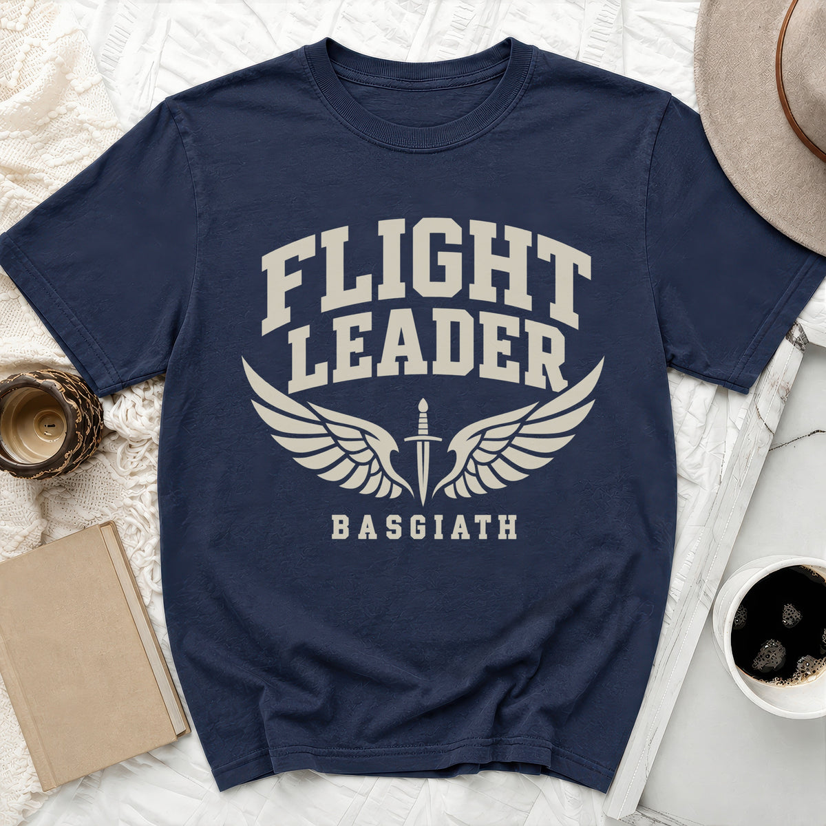 Navy t-shirt with "FLIGHT LEADER BASGIATH" and winged dagger graphic.