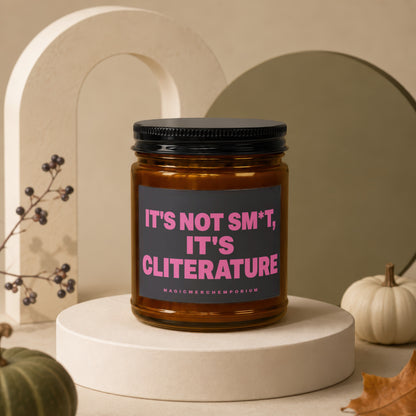 Amber candle with black lid and label saying "It's not sm*t, it's cliterature".