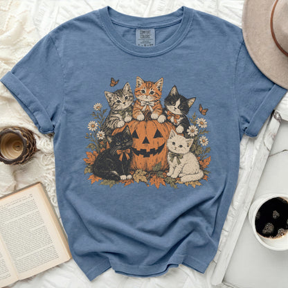 Blue t-shirt with vintage cats and pumpkin Halloween graphic.