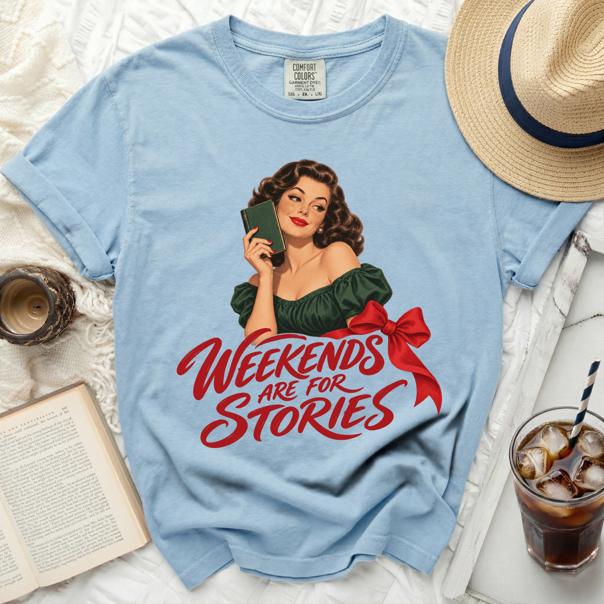 Light blue t-shirt with vintage woman graphic and text "Weekends are for Stories".