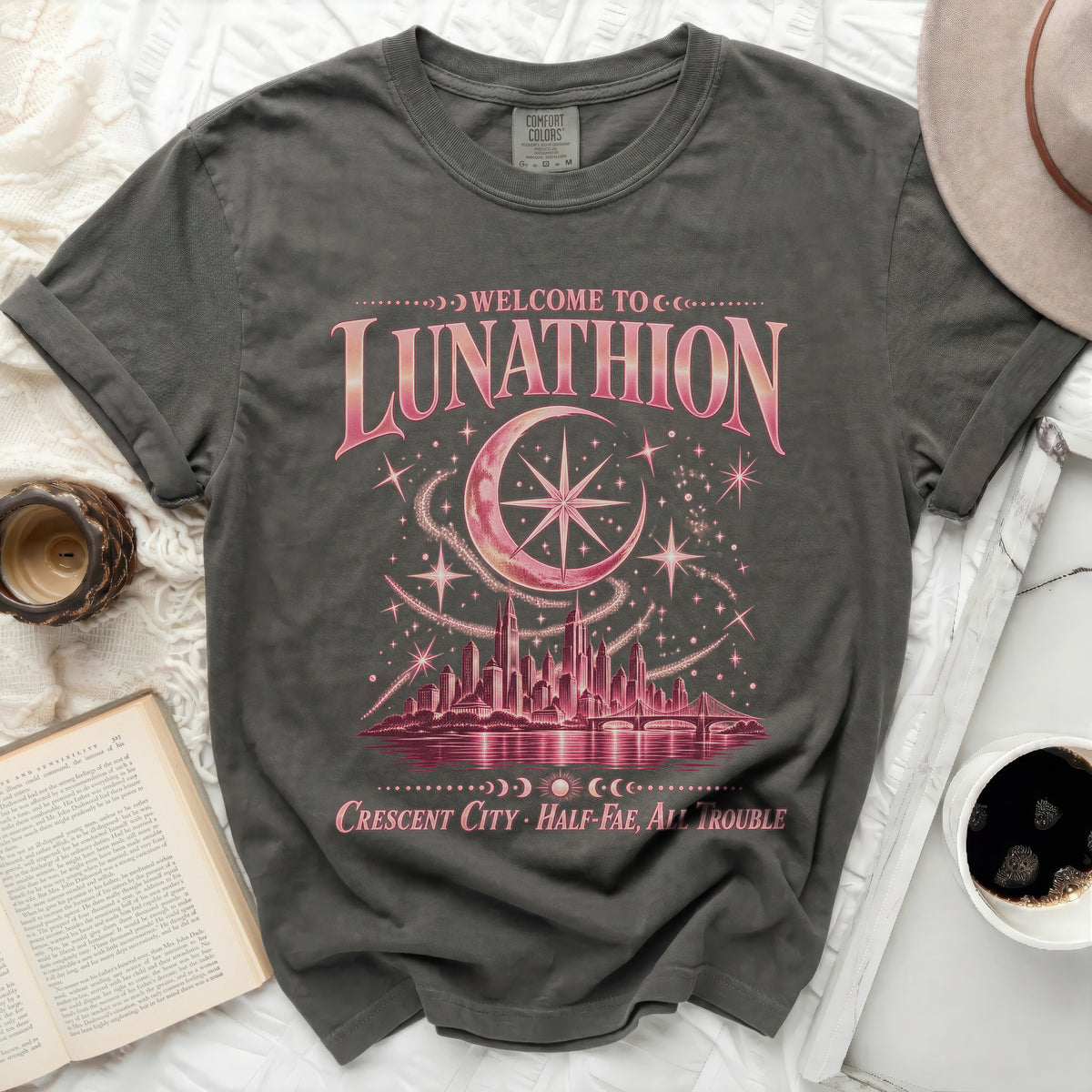 Gray t-shirt with "Welcome to Lunathion Crescent City Half-Fae, All Trouble" graphic.