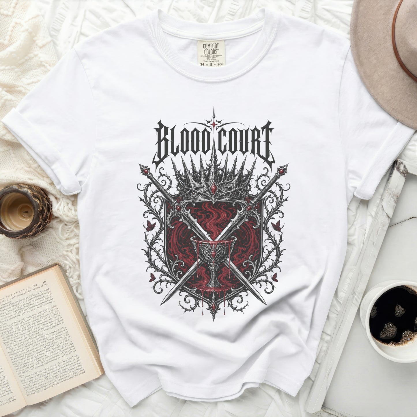 White t-shirt with "Blood Court" text and a crest graphic.