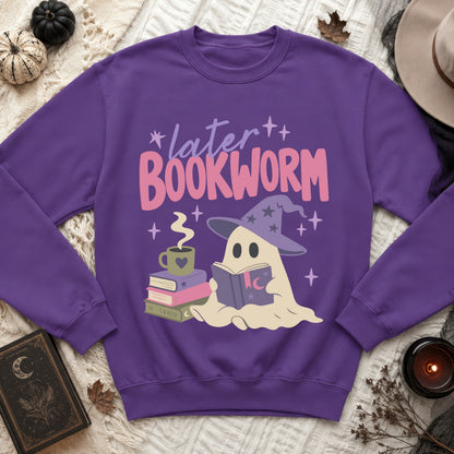 Purple sweatshirt with a graphic of a ghost reading a book and the text "later BOOKWORM".