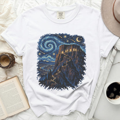 White t-shirt with a starry night and castle illustration.