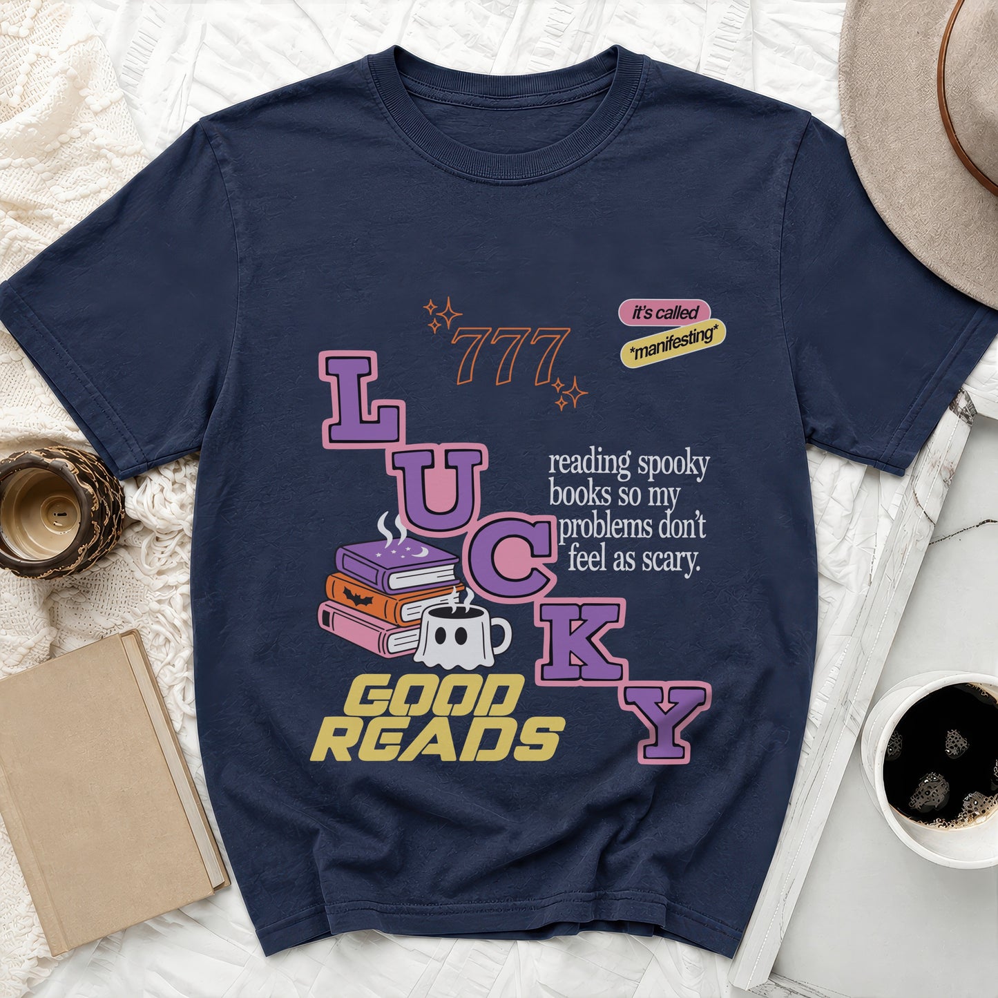 Navy t-shirt with "LUCKY GOOD READS" text and spooky book graphics.