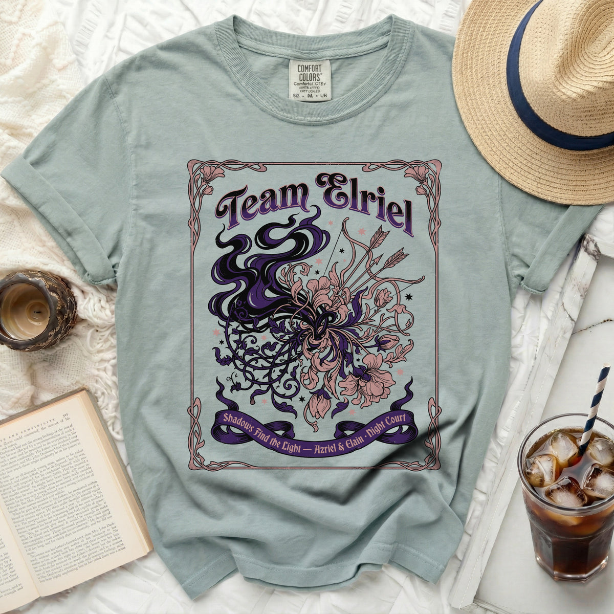 Team Elriel shirt with decorative floral and bow accents.
