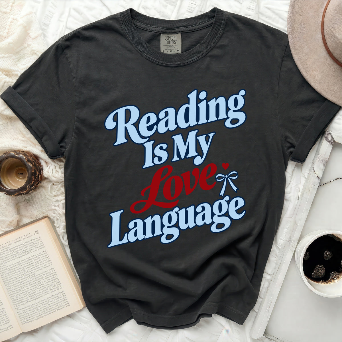 Dark gray t-shirt with "Reading Is My Love Language" graphic.