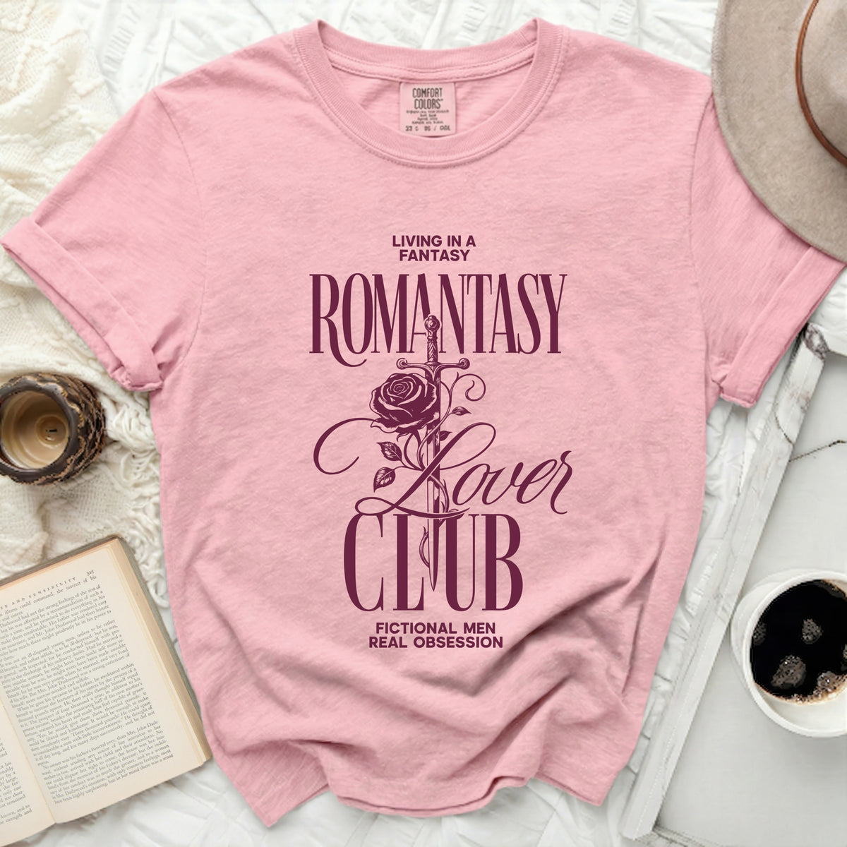 Pink t-shirt with "Romantasy Lover Club" graphic and sword and rose.