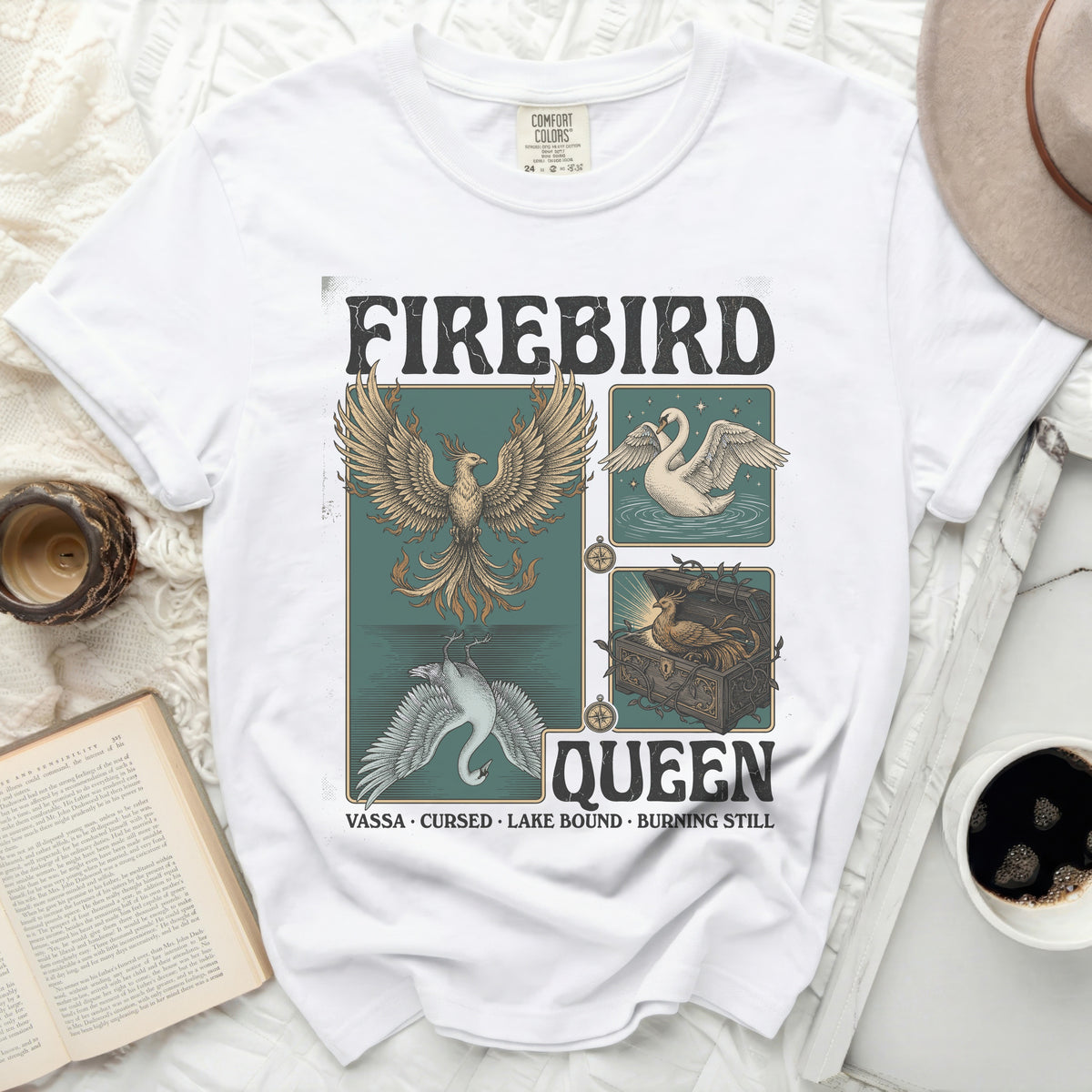 White t-shirt with "Firebird Queen" graphic featuring a phoenix, swan, and chest.