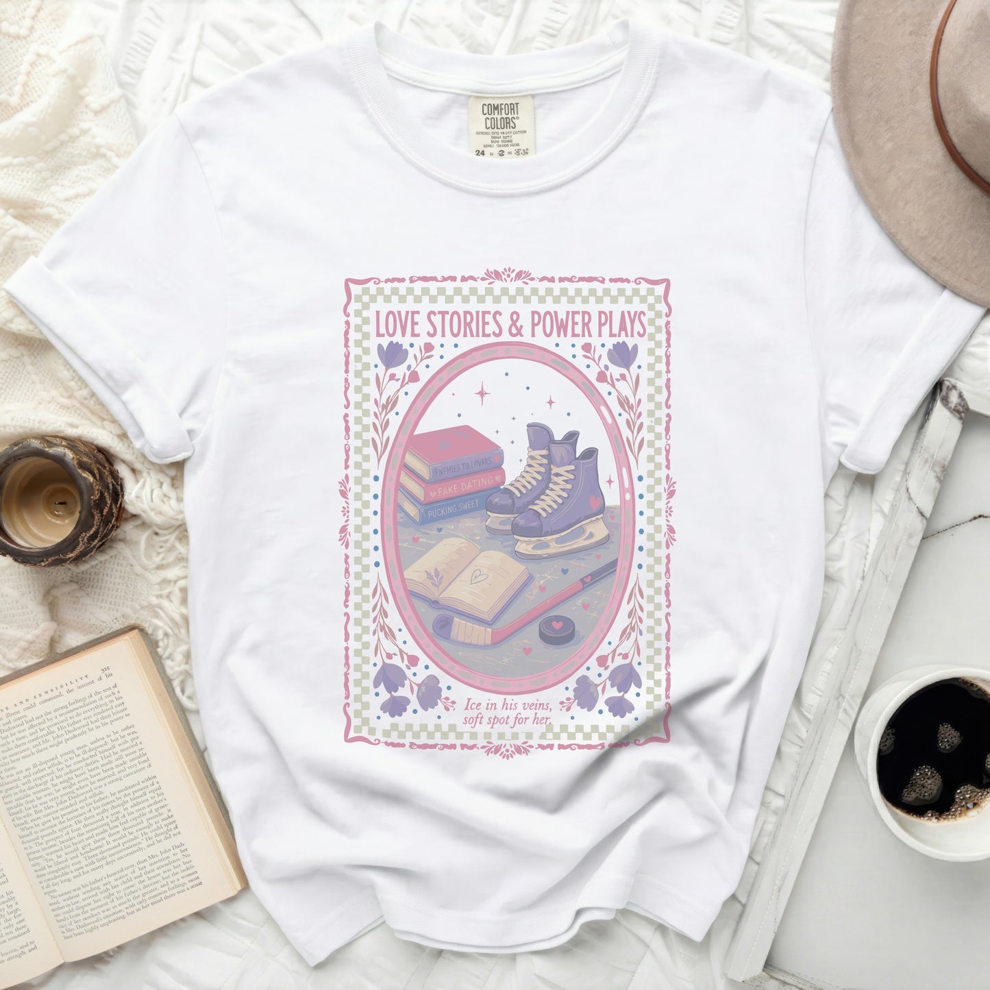 White t-shirt with "Love Stories & Power Plays" graphic featuring ice skates.