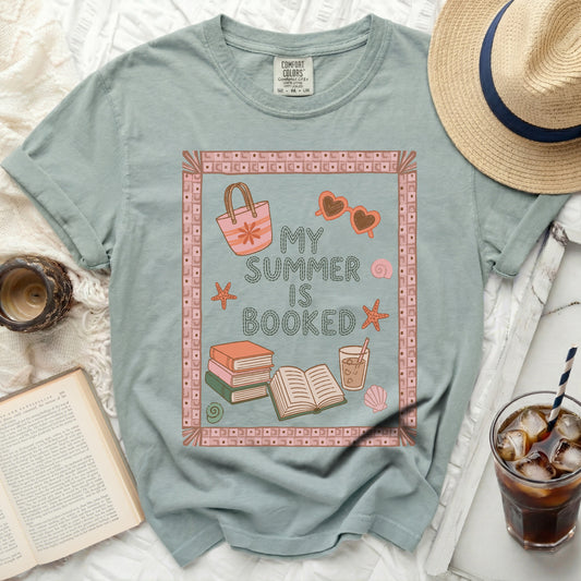 T-shirt with "My Summer Is Booked" text and beach icons.