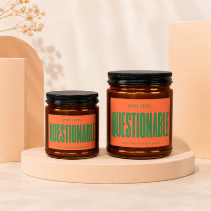 Two amber jars with black lids, labeled "SPICE LEVEL: QUESTIONABLE."