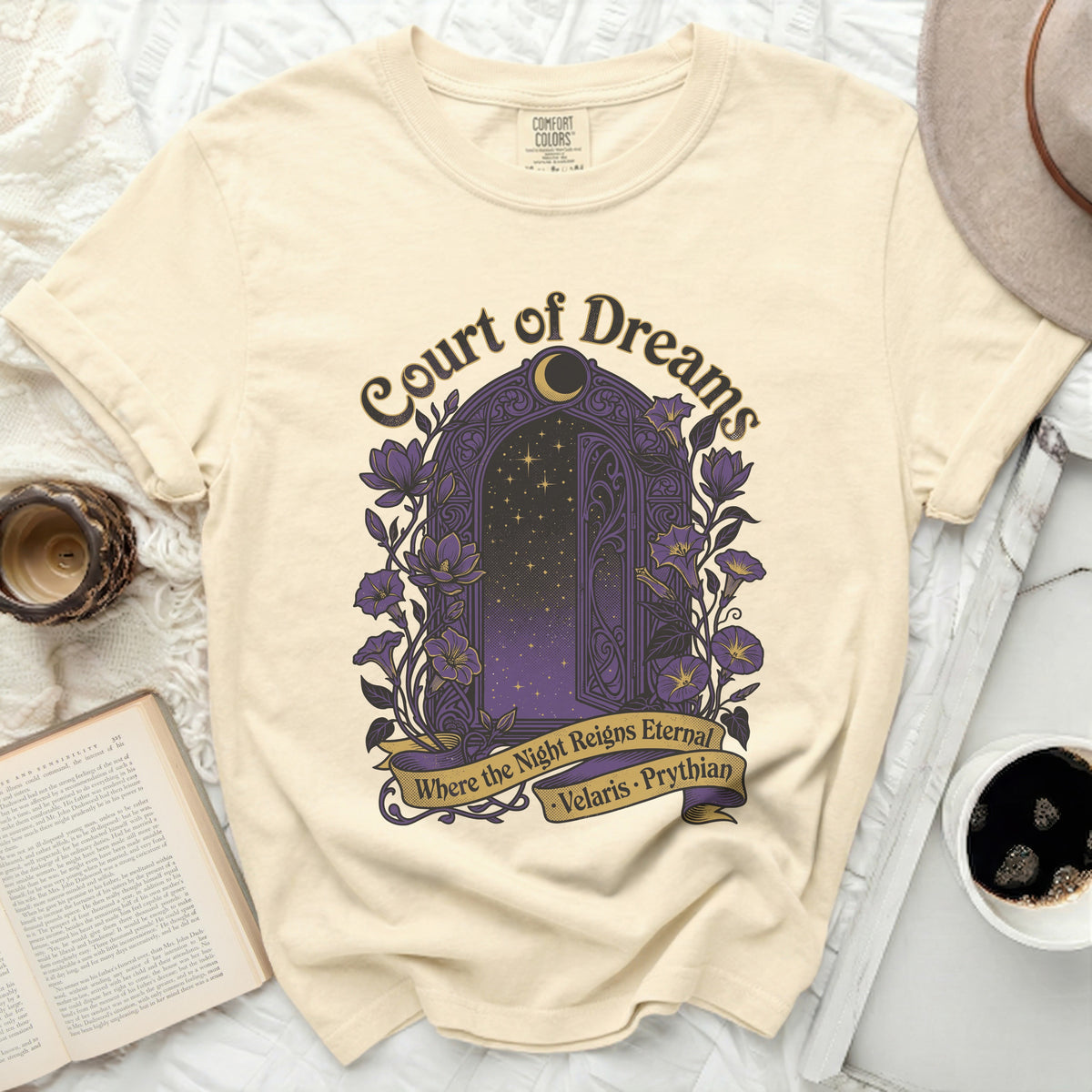 Cream t-shirt with "Court of Dreams" and a purple archway with stars.