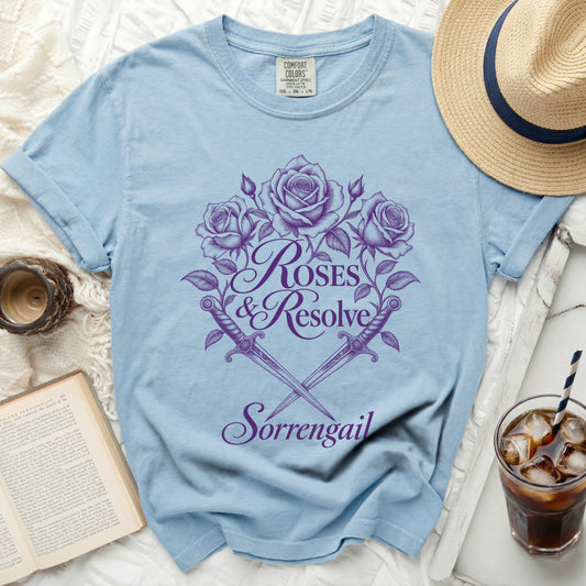 Light blue t-shirt with purple "Roses & Resolve Sorrengail" graphic.