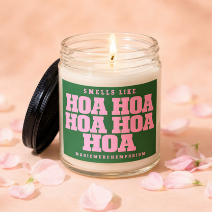 Lit candle with "Smells Like Hoa Hoa Hoa Hoa Hoa" text and the "MagicMerchEmporium" brand.