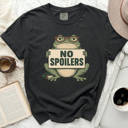 T-shirt with a frog wearing glasses holding a "NO SPOILERS" sign.
