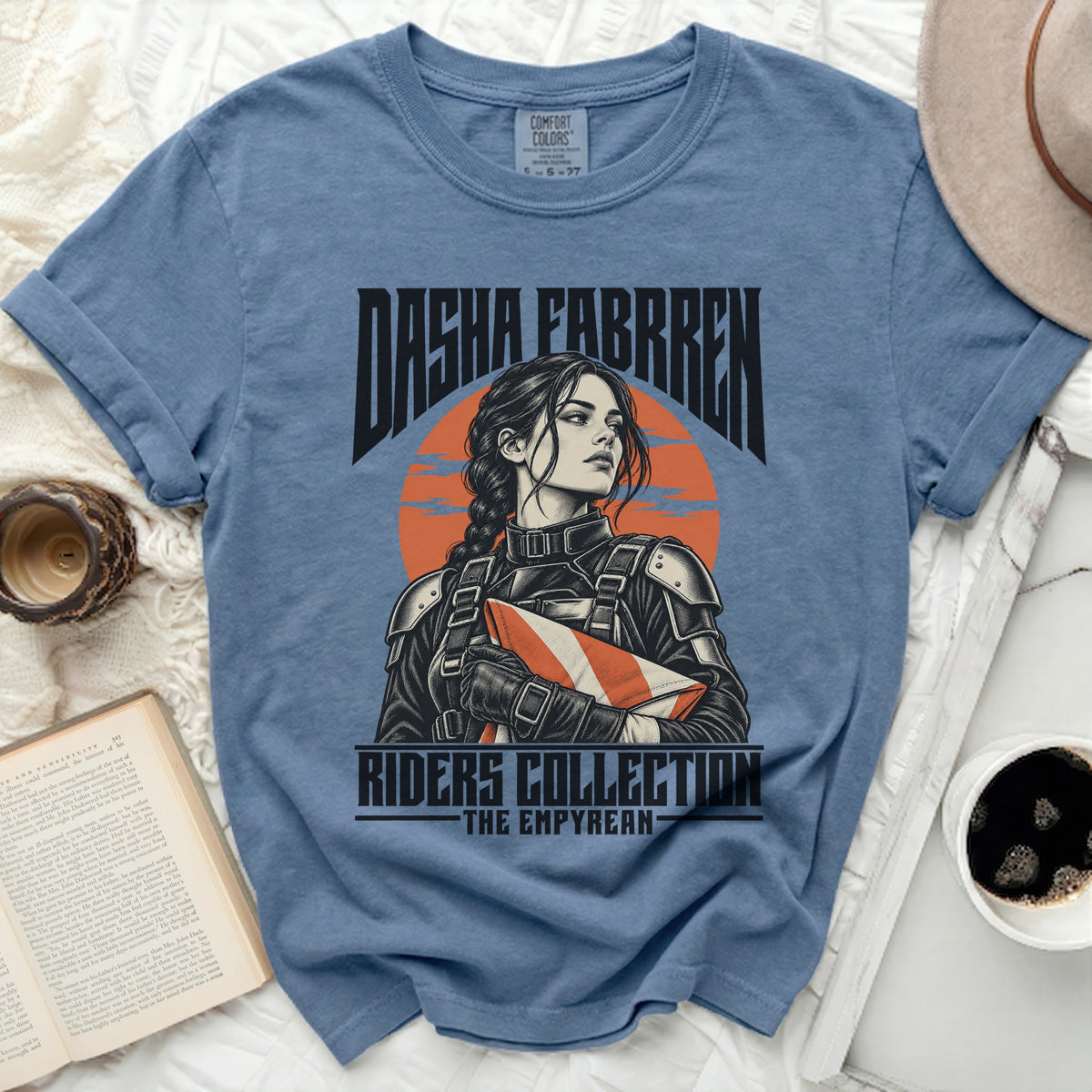 Blue t-shirt with Dasha Farren illustration and "Riders Collection - The Empyrean" text.