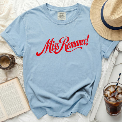 Light blue t-shirt with red "Miss Romance!" graphic and comfort colors tag.