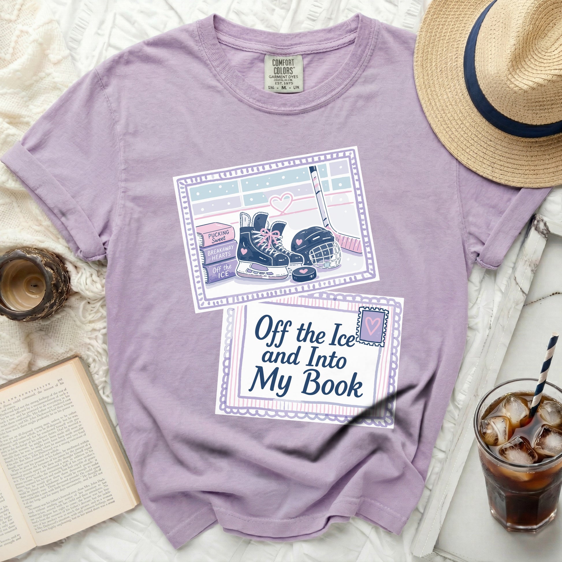 Purple t-shirt with ice skating graphic and text "Off the Ice and Into My Book".
