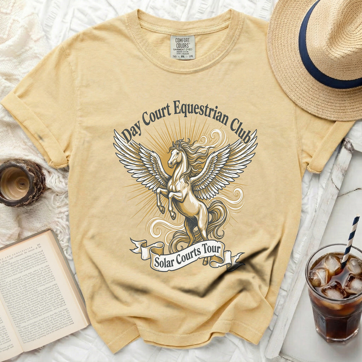 Yellow t-shirt with winged horse graphic and text "Day Court Equestrian Club Solar Courts Tour".
