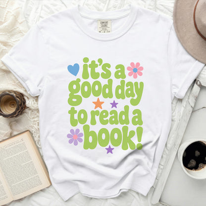 White t-shirt with green text "it's a good day to read a book!"