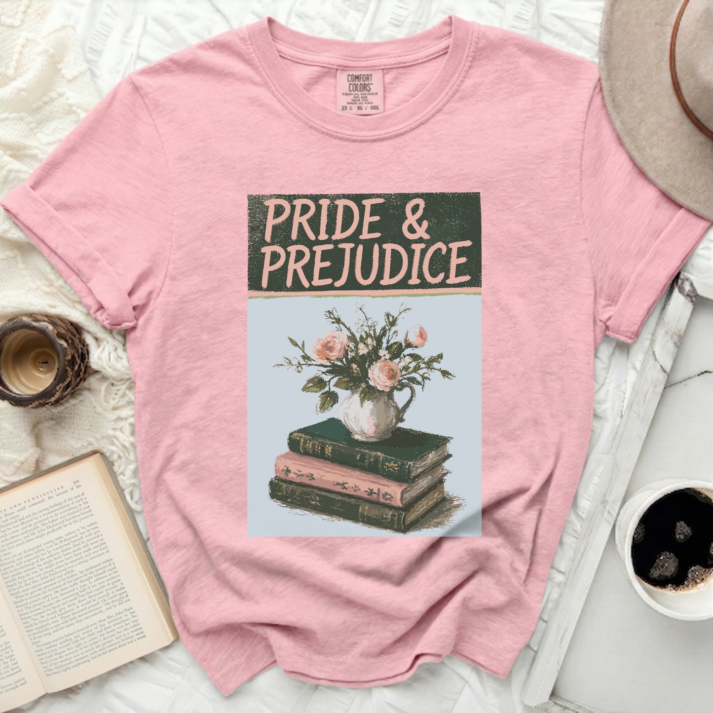 Pink t-shirt with "Pride & Prejudice" text and floral book graphic.