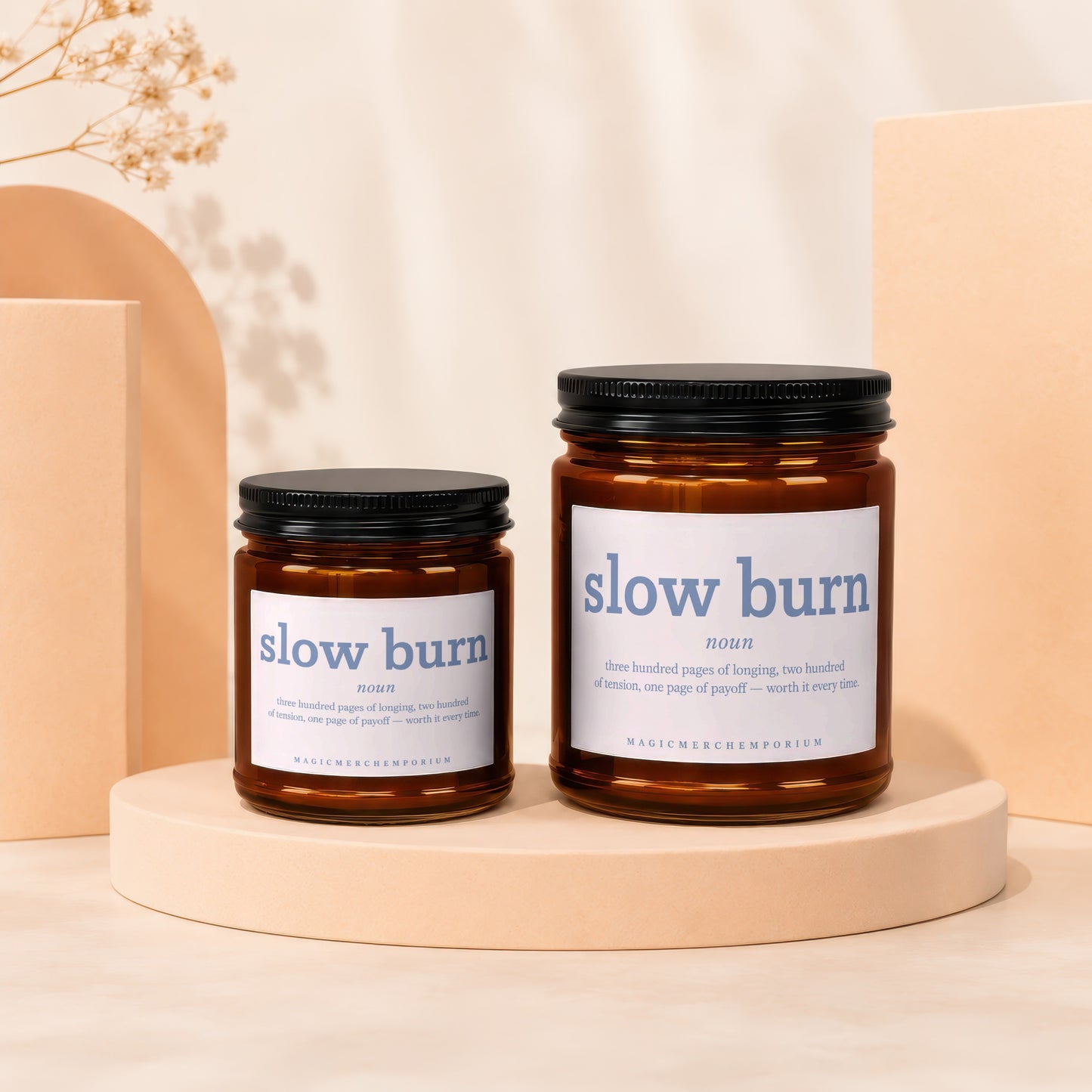 Two amber jar candles labeled "slow burn" with descriptive text and brand name.