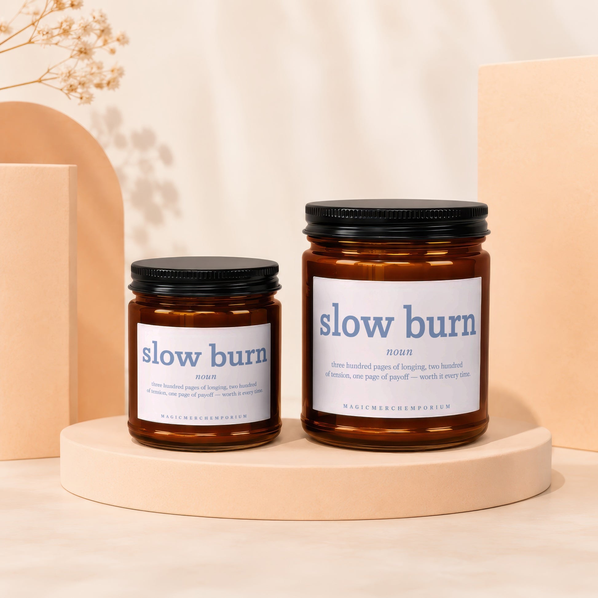 Two amber jar candles labeled "slow burn" with descriptive text and brand name.