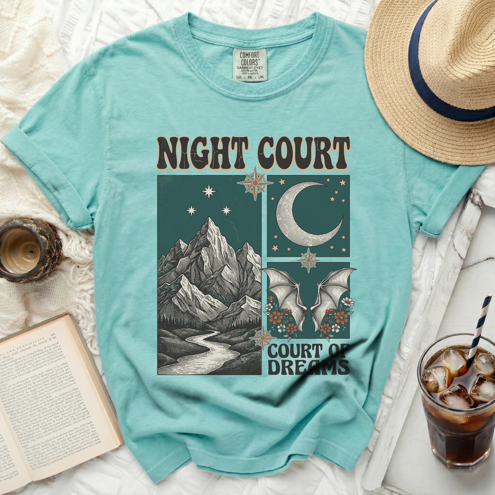 Teal t-shirt with "Night Court Court of Dreams" graphic art.