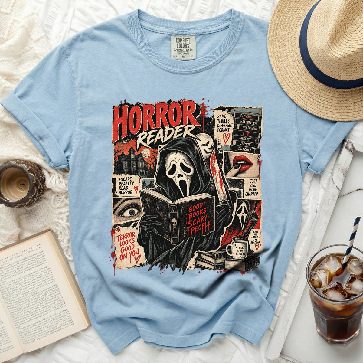 Light blue t-shirt featuring a "Horror Reader" graphic with a ghost reading a book.