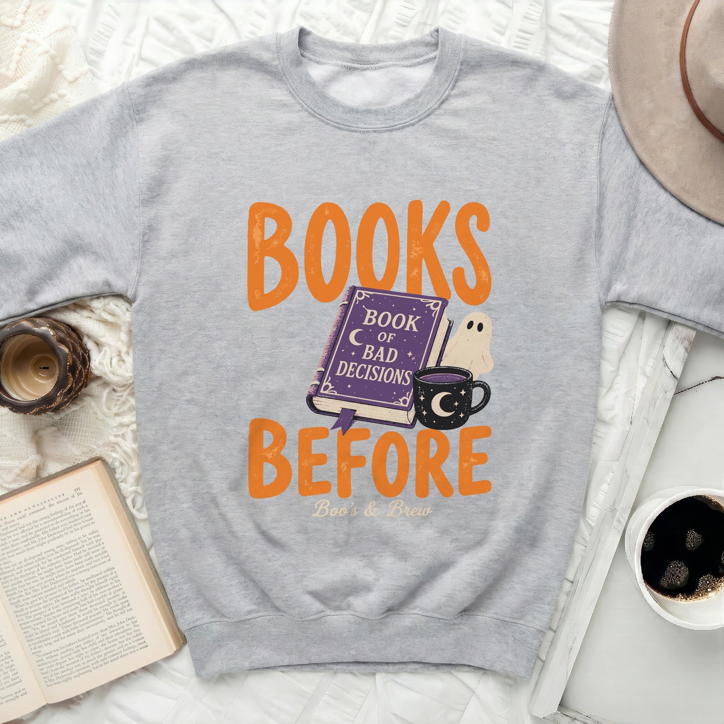 Grey sweatshirt with "Books Before Boo's & Brew" Halloween graphic.