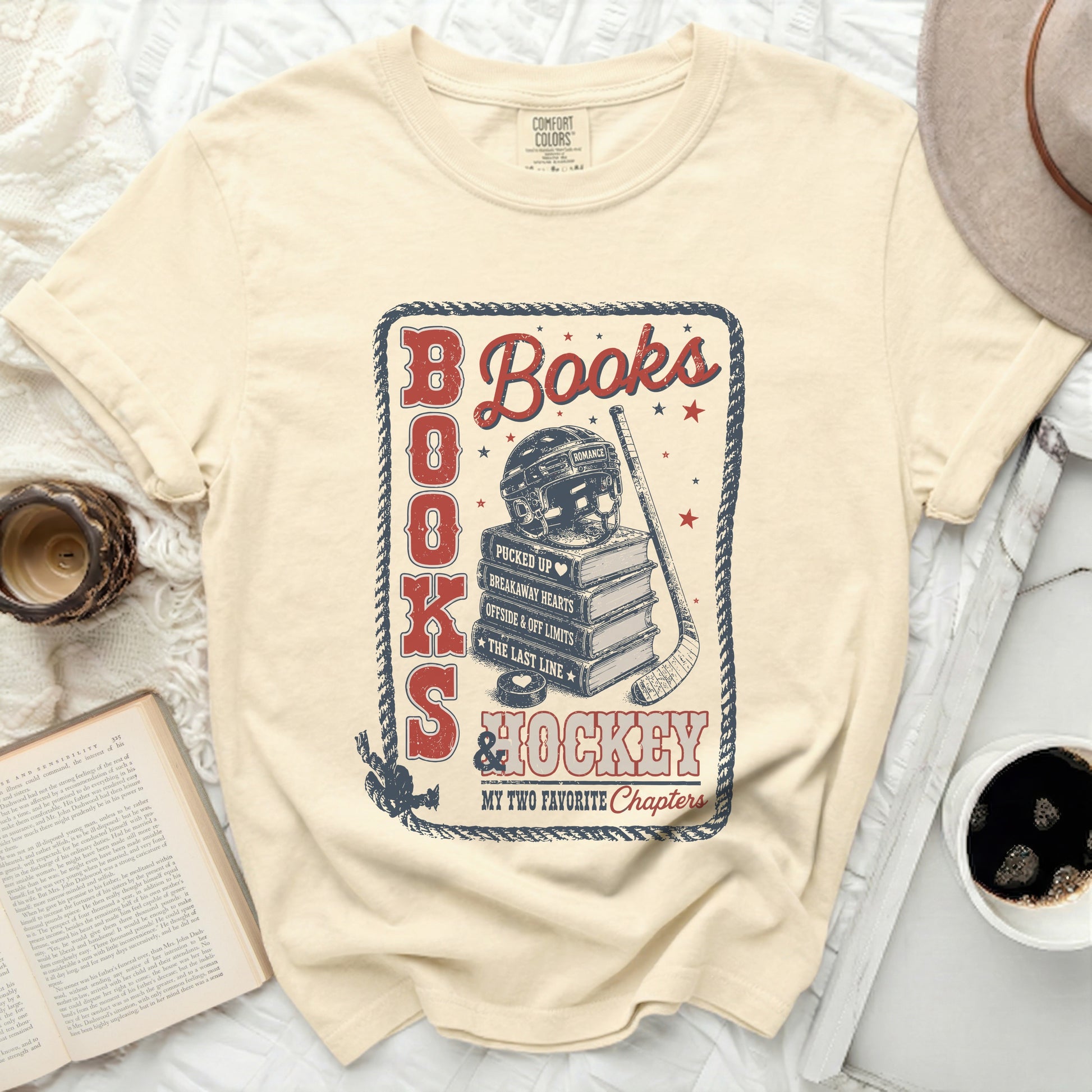 Cream t-shirt with "Books & Hockey" and book/hockey graphic.