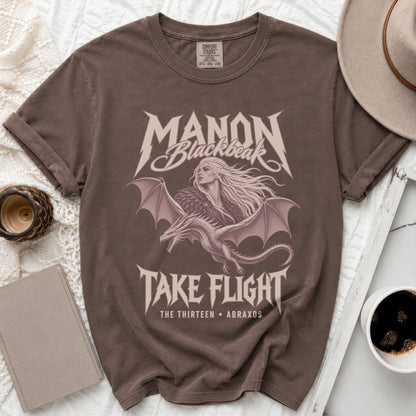 Brown t-shirt with Manon Blackbeak, dragon, and "Take Flight" graphic.