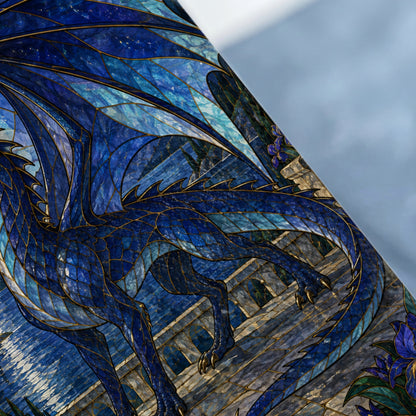 Stained glass dragon with blue tones and gold accents, against a stone architectural background.