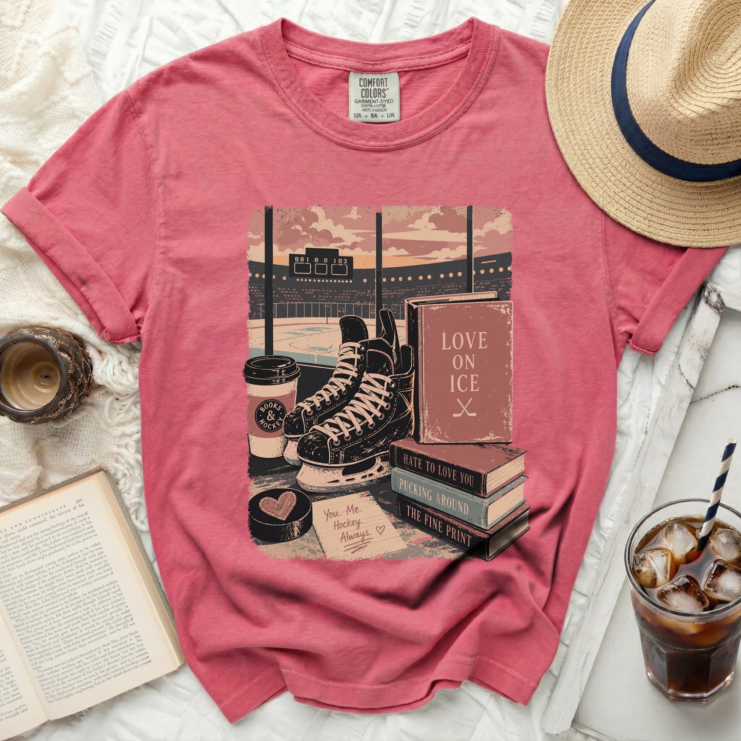 T-shirt with hockey scene, books, coffee, and text "Love on Ice."