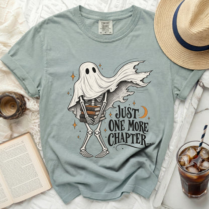 Skeleton ghost wearing a sheet holding books with text "Just One More Chapter..."