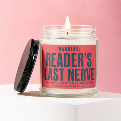 Candle with lid off, light on, reading "WARNING: READER'S LAST NERVE".