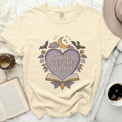 Cream t-shirt with "Books Before Boos" graphic featuring a heart, moon, and bats.