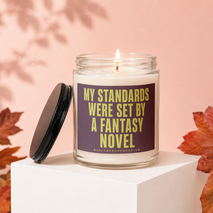 Scented candle with text "MY STANDARDS WERE SET BY A FANTASY NOVEL".