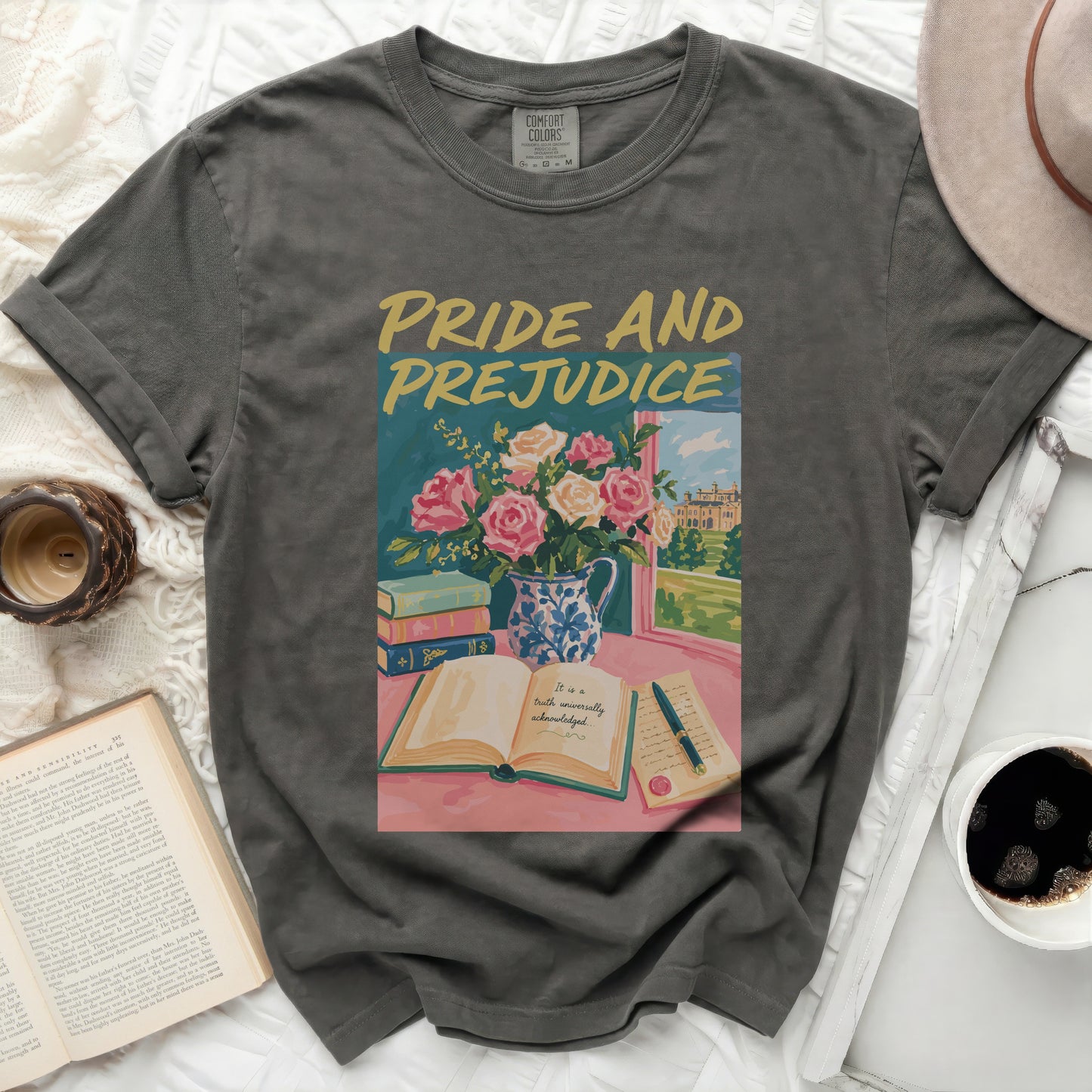 Dark gray Comfort Colors t-shirt with "Pride and Prejudice" graphic.