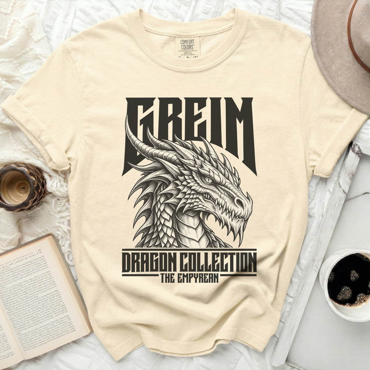 Cream t-shirt with a black detailed dragon graphic and text "FREIM DRAGON COLLECTION THE EMPYREAN".