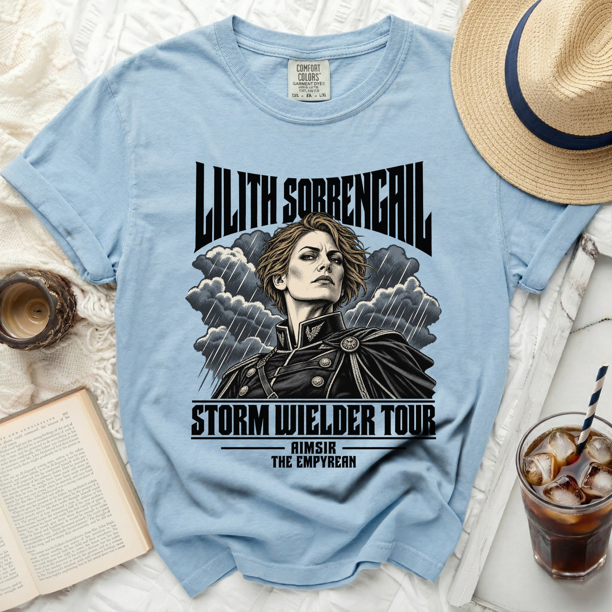 Light blue t-shirt with "Lilith Sorrengail Storm Wielder Tour" graphic.