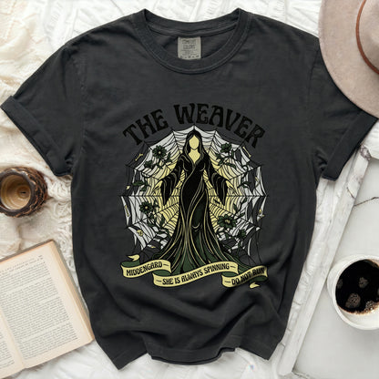T-shirt with "The Weaver" and spiderweb design, "MIDDENGARD" and "SHE IS ALWAYS SPINNING DO NOT RUN" text.