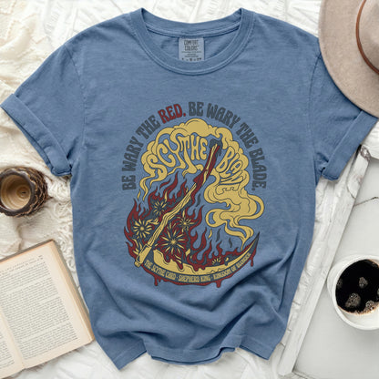 Blue t-shirt with "Be Wary the Red. Be Wary the Blade." text and scythe graphic.