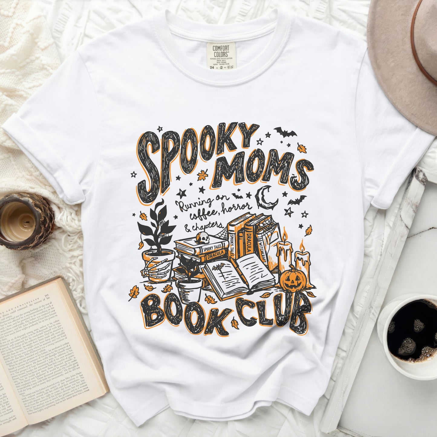 White t-shirt with "Spooky Moms Running on coffee, horror & chapters book club" graphic.