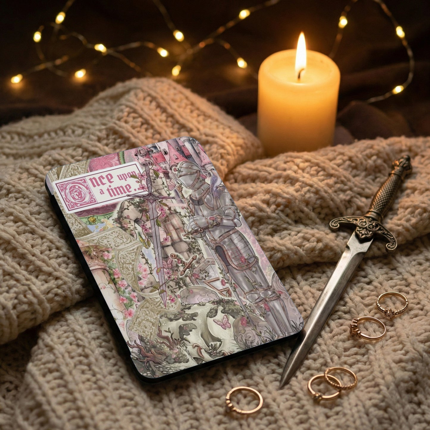 Journal with "nce upon a time" text, featuring a knight, sword, and fairy tale art.