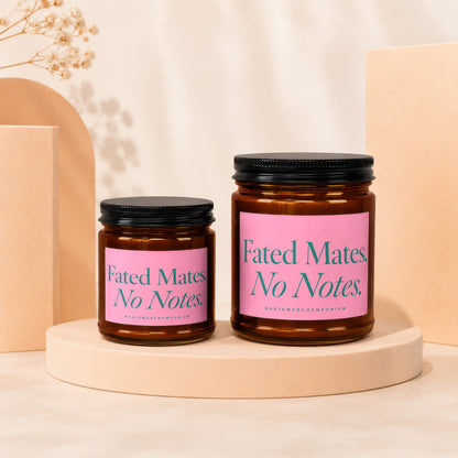 Two brown jar candles with pink labels reading "Fated Mates. No Notes."